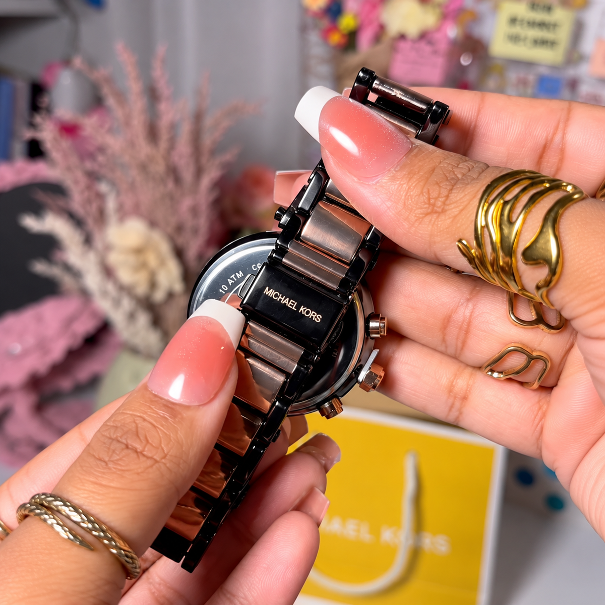 Close-up of the MK Parker Black Gold two-tone bracelet and clasp